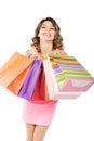 Young cheerful girl with shopping bags isolated on white Royalty Free Stock Photo