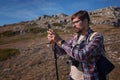 Young man taking photographs with digital camera in a mountains. Royalty Free Stock Photo