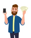 Young cheerful man showing or holding a mobile, cell, smart phone and bunch of cash, money, dollar, currency, bank notes in hand.