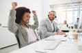 Young cheerful mixed race female call center agent cheering in joy while answering calls wearing a headset at work Royalty Free Stock Photo