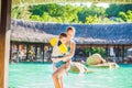 Young cheerful mother and son in a swimming pool