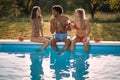 Young  people having fun at summer in pool Royalty Free Stock Photo