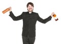 Young cheerful priest with bottle of alcohol isolated Royalty Free Stock Photo