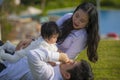 Young cheerful and sweet wife and husband couple with mother and father playing with little daughter in Asian Chinese family Royalty Free Stock Photo