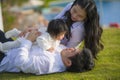 Young cheerful and sweet wife and husband couple with mother and father playing with little daughter in Asian Chinese family Royalty Free Stock Photo