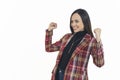 young cheerful woman celebrating her success by holding her fists up, medium shot copy space isolated Royalty Free Stock Photo