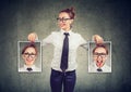 Cheerful woman showing different photos with emotions