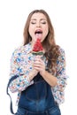 Young cheerful woman sucks lollipop