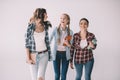 Young cheerful women students with textbooks in hands Royalty Free Stock Photo