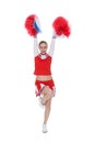 Young cheerleader holding pom-poms