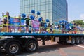 Young cheerleaders riding on truck at parade