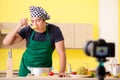 The young chef blogger explaining food preparation Royalty Free Stock Photo