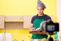 The young chef blogger explaining food preparation Royalty Free Stock Photo
