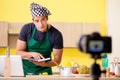 The young chef blogger explaining food preparation Royalty Free Stock Photo