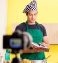 Young chef blogger explaining food preparation Royalty Free Stock Photo