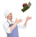 Young chef cook throwing present box.