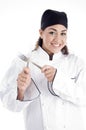 Young chef holding metal cutlery Royalty Free Stock Photo