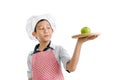 Young chef serving green apple on wooden tray Royalty Free Stock Photo