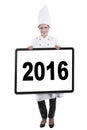 Young chef showing number 2016 on board Royalty Free Stock Photo