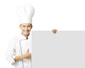 Young chef with thumb up and showing empty board