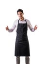 Young chef or waiter wearing black apron isolated Royalty Free Stock Photo