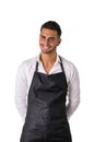 Young chef or waiter wearing black apron isolated Royalty Free Stock Photo