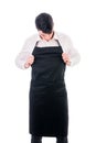 Young chef or waiter wearing black apron isolated Royalty Free Stock Photo