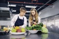 Young chefs are cooking and preparing ingredients