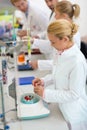 Young chemical technicians work with test tubes in lab Royalty Free Stock Photo