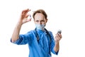 Young chemist, doctor wearing blue uniform, face mask and gloves conducts chemical research isolated on white background Royalty Free Stock Photo