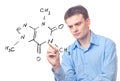 Young chemist and formula of caffeine Royalty Free Stock Photo