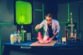 Young chemist making experiments in laboratory Royalty Free Stock Photo