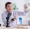 Young chemist student experimenting in lab Royalty Free Stock Photo