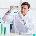 Young chemist student working in lab on chemicals Royalty Free Stock Photo