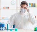 Young chemist student working in lab on chemicals Royalty Free Stock Photo