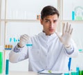Young chemist student working in lab on chemicals Royalty Free Stock Photo