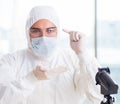 Young chemist student working in lab on chemicals Royalty Free Stock Photo