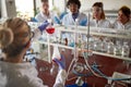 Young chemistry students are excited about experiment they doing in a laboratory. Science, chemistry, lab, people Royalty Free Stock Photo