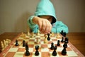 Young chess player plays chess Royalty Free Stock Photo