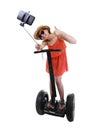 Young chic tourist woman taking selfie photo with mobile phone while riding on segway