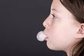 Young Child Blowing a Bubble with Gum Royalty Free Stock Photo