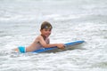 Young child with a bodyboard on the beach Royalty Free Stock Photo