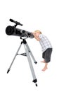 Young child or boy looking through a telescope Royalty Free Stock Photo