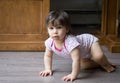 A young child crawling on the floor