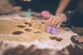 Young child cuts out cookies