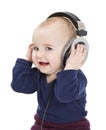 Young child with ear-phones listening to music Royalty Free Stock Photo