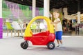 Toddler Playing with Toy Car in Playroom Royalty Free Stock Photo