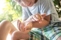 Young child examining a ladybug