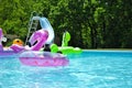 Young child floating on an inflatable in the pool