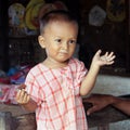 Young child with funny face in Bagan, Myanmar